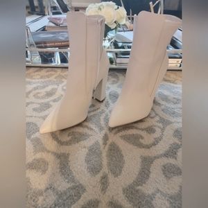 Size 10 white zip up ankle booties. Never worn